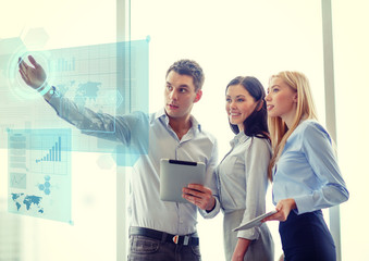 business team working with tablet pcs in office