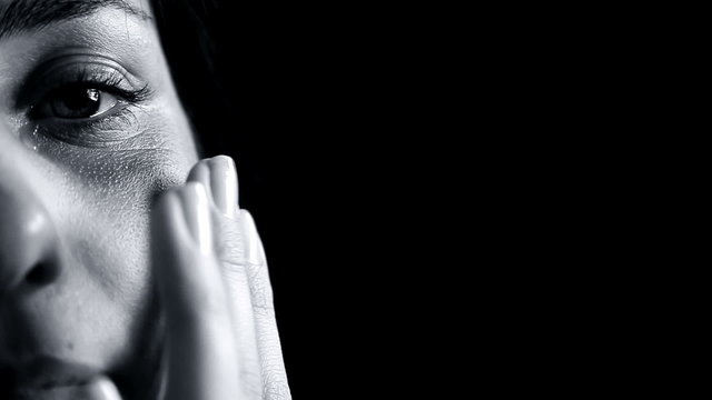 Black and white portrait of woman after violence