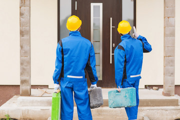 group of builders with toolboxes