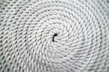 Rope coiled on dock