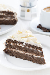 piece of chocolate cake with butter cream, vertical, close-up
