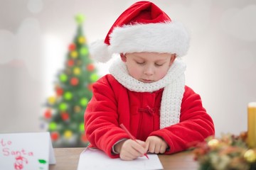 Composite image of cute boy drawing festive pictures