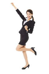 happy young businesswoman jumping and dancing