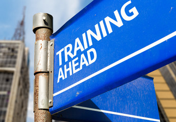 Training Ahead blue road sign