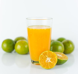 glass of fresh orange juice on white