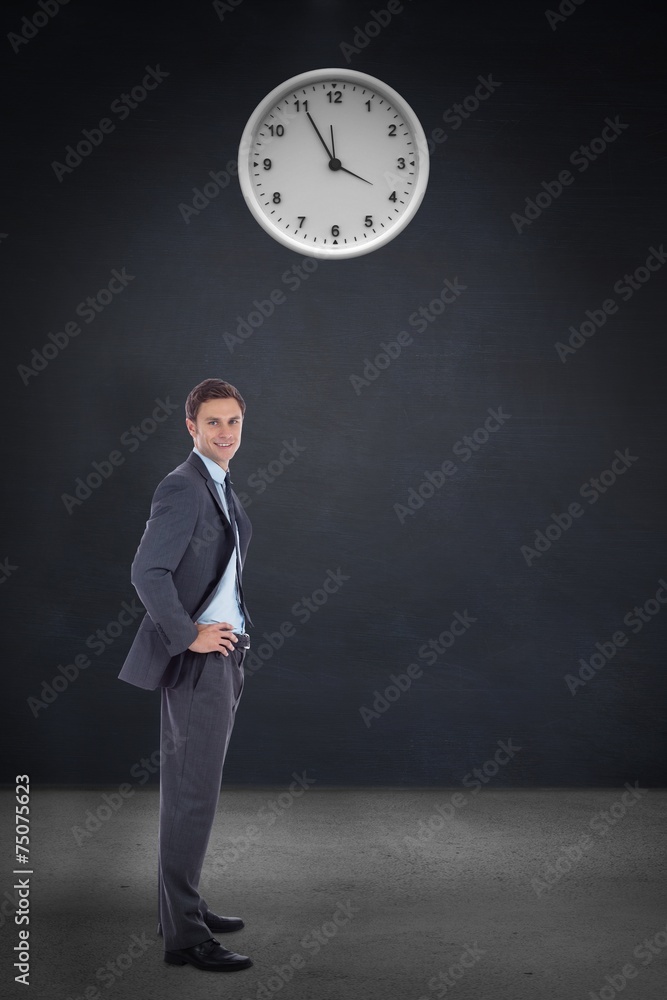 Poster composite image of smiling businessman with hands on hips