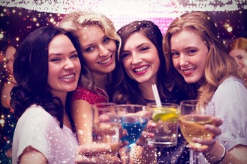 Composite image of friends with drinks - obrazy, fototapety, plakaty