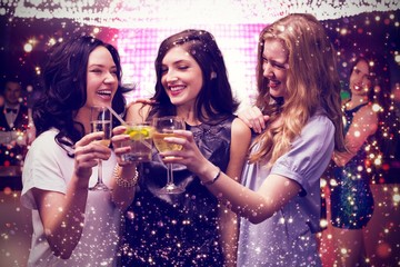 Obraz na płótnie Canvas Composite image of friends with drinks