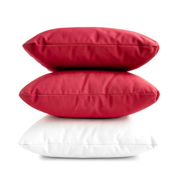 Stack of three cushions or pillows isolated on white background