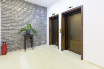 Interior of a corridor with two passenger lift 