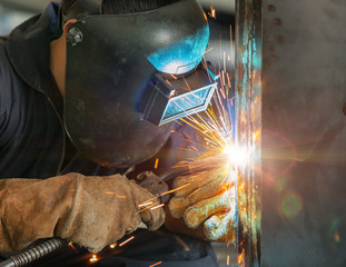 Fototapeta worker welding construction by MIG welding obraz