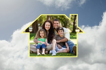 Composite image of happy family sitting in the garden