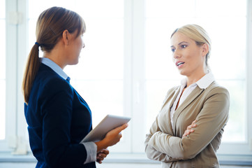 Two businesswoman discussing