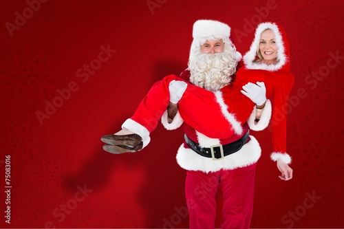 Composite Image Of Santa And Mrs Claus Smiling At Camera Composite Image Of Santa And Mrs Claus Smiling At Camera