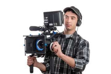Obraz premium young cameraman and professional camera
