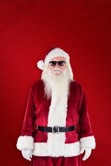 Composite image of santa claus wears black sunglasses