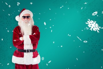 Composite image of santa claus wears black sunglasses