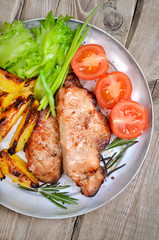 Roasted steaks on rustic table