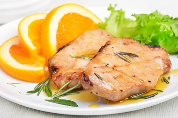 Pork cutlets with orange sauce