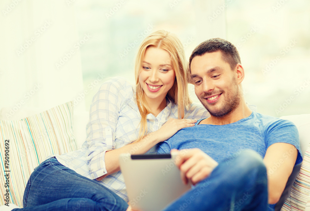 Sticker smiling happy couple with tablet pc at home