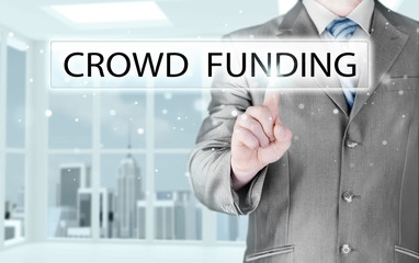 Businessman pushes virtual crowd funding button