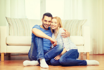 smiling happy couple at home