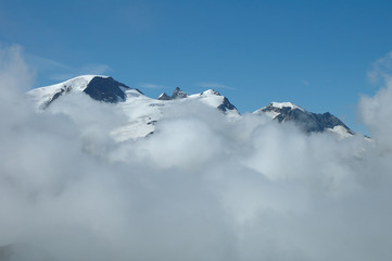 Peaks over clouds nearby Sustenpass