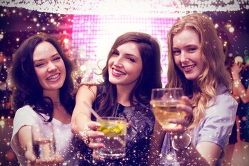 Obraz na płótnie Canvas Composite image of friends with drinks