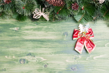 green board with pine needles and cones Christmas toys and Chris