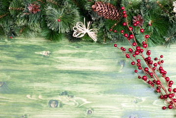 green board with pine needles and cones Christmas toys and Chris