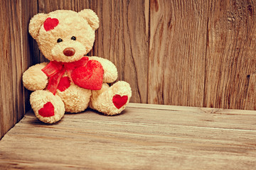 Valentines Day. Teddy Bear with red hearts. Love concept. Retro.
