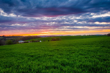Sunset over farm fields in rural York County, Pennsylvania.