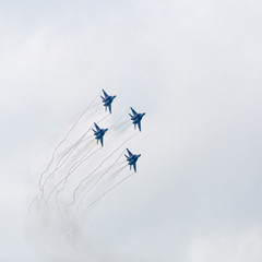 Four war jet planes in sky