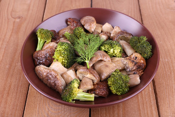 Braised wild mushrooms with vegetables and spices in plate
