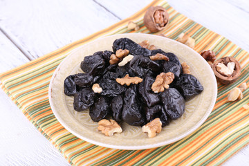 Plate of prunes and walnut