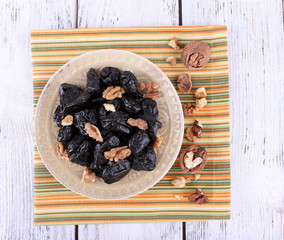 Plate of prunes and walnut