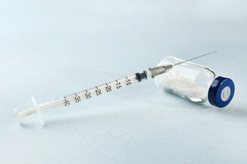 Vaccine in vial with syringe