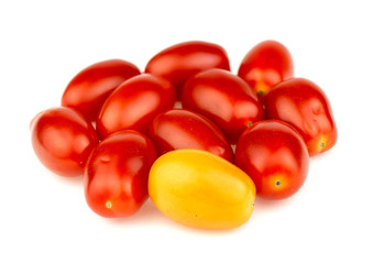 Group of ripe red and gold grape tomatoes isolated against white