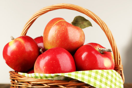 Wicker basket of red apples with green napkin