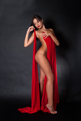 Nude body covered with a reb fabric