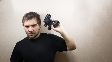 Fototapeta na wymiar young man with binoculars