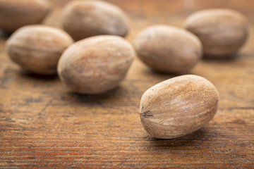 pecan nuts on grunge wood