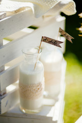 milk in glass bottle with decoration