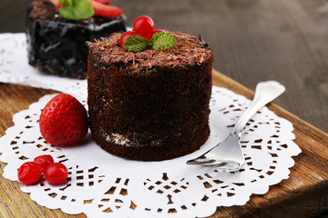 Yummy chocolate cupcake on table