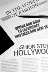 On-line news concept. Computer mouse, PC tablet and newspaper,