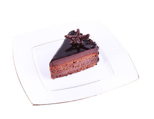 Delicious chocolate cake on plate isolated on white