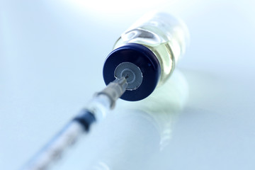 Vaccine in vial with syringe
