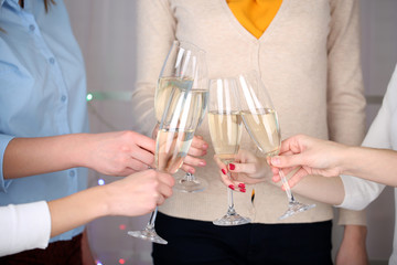 Woman hands with glasses of champagne