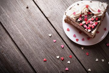 cake with hearts on wooden background