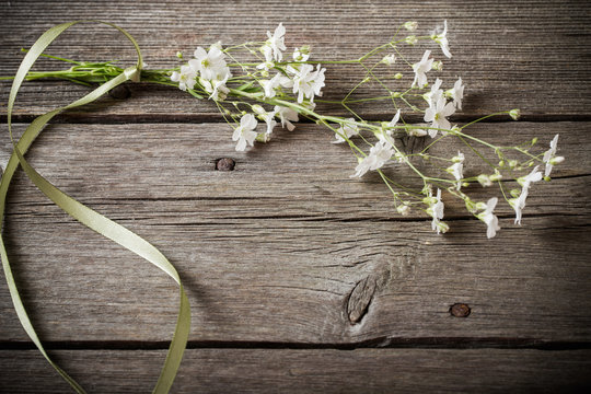 bunch of Gypsophila on old wooden table